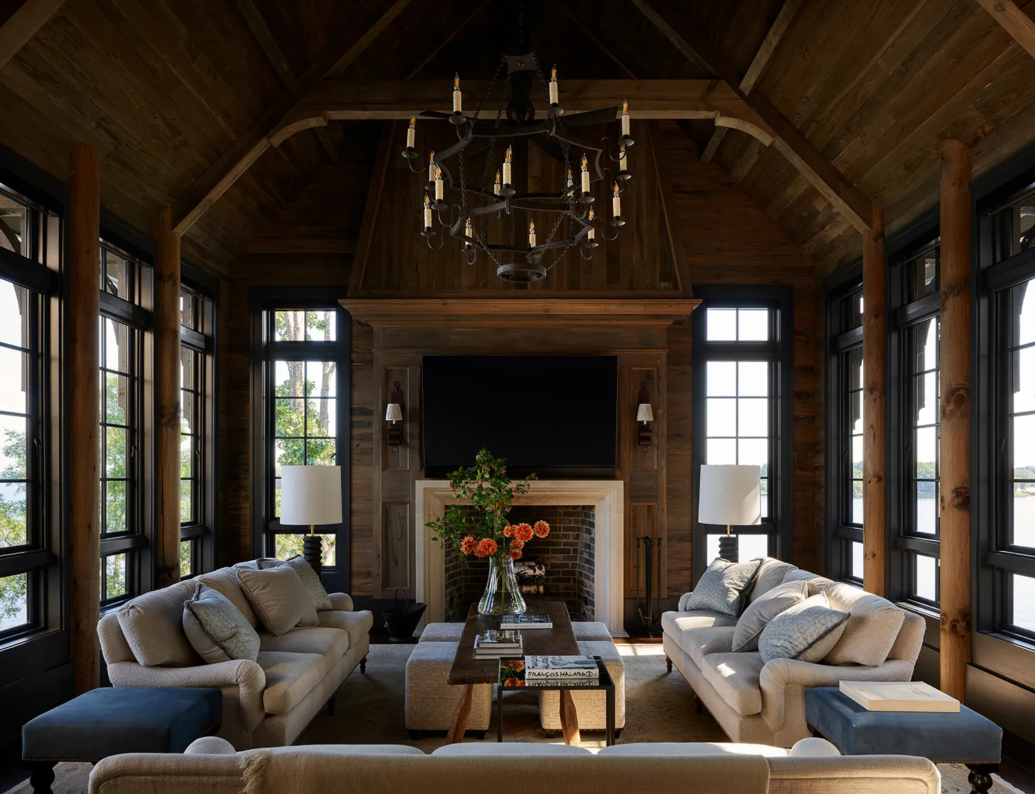 Home 73 | The Home X Luxury living room remodel with timber cathedral ceiling, central chandelier, and layered seating design by The Home X.