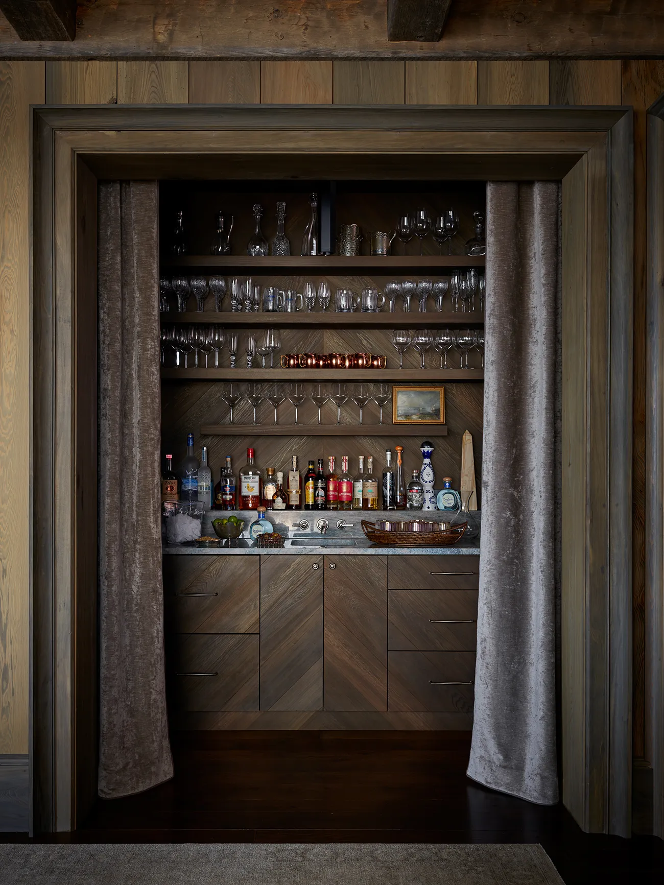 Home 74 | The Home X Private, enclosed bar space with warm wood tones and soft drapery — symbolizing discretion and respect for client privacy at The Home X.