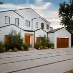 The exterior of a blue remodeled home.