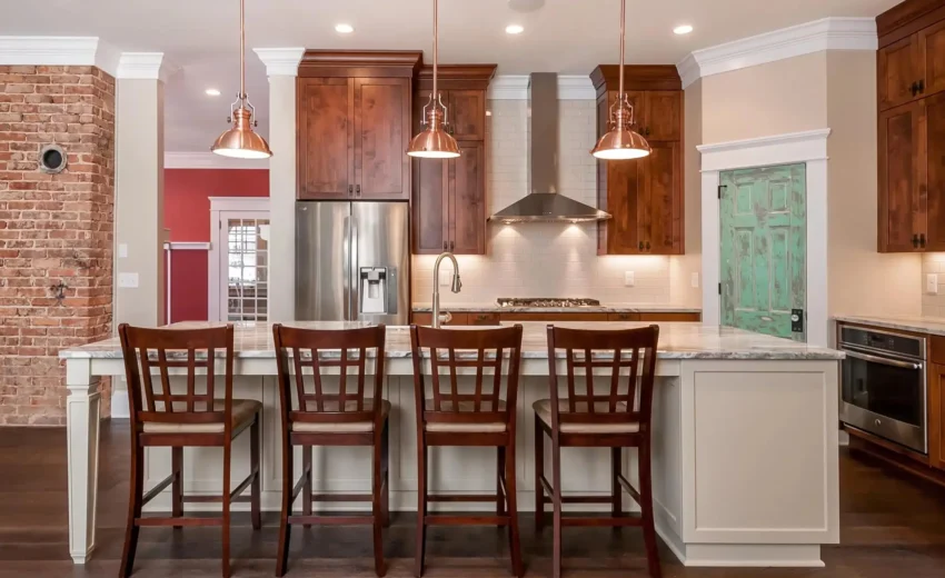 Open kitchen with brick backsplash, wood cabinetry, and large island seating in Lambertville, NJ