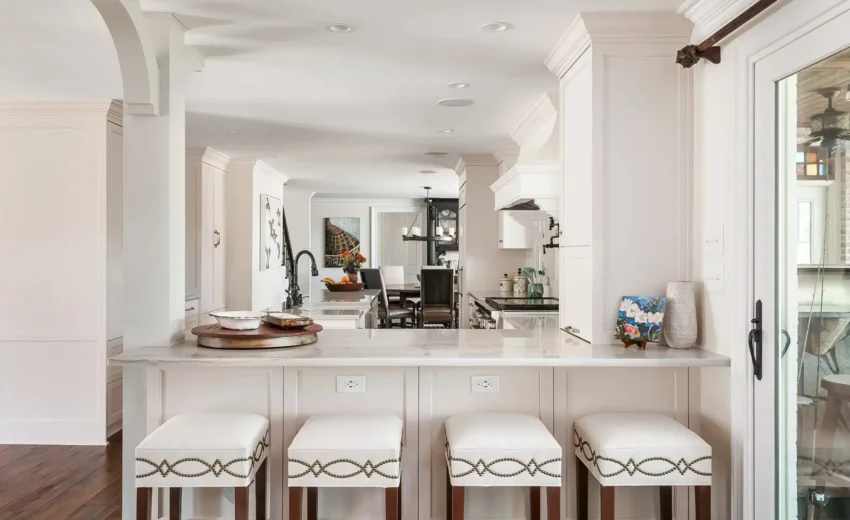 Modern bar with white oak cabinetry, floating shelves, and warm under-cabinet lighting in Princeton, NJ remodel