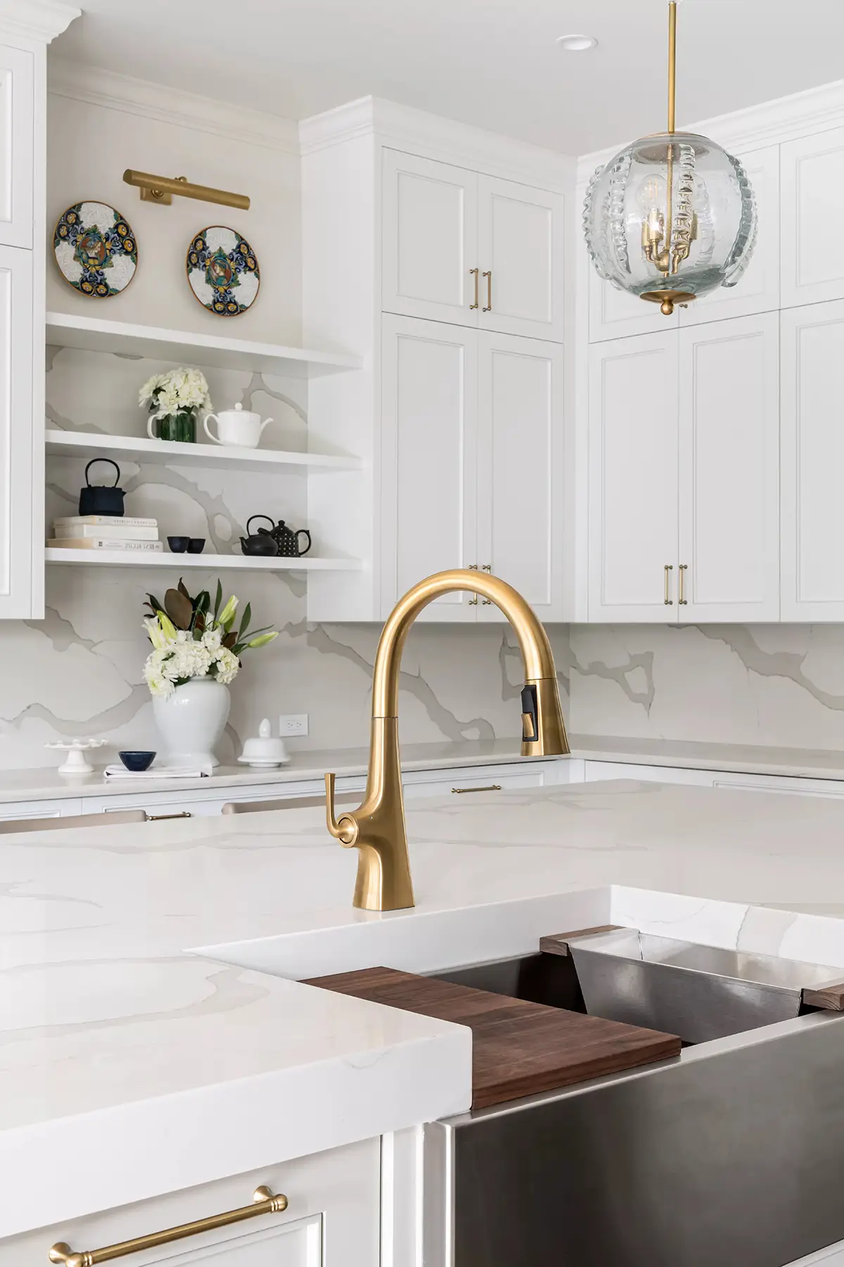 Moore St, Princeton, NJ 08540 7 | The Home X Bright transitional kitchen with white shaker cabinets, globe sconces, and a brushed gold faucet.