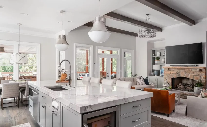 Bright kitchen with vaulted ceilings, white cabinetry, wood accents, and black fixtures in Princeton NJ