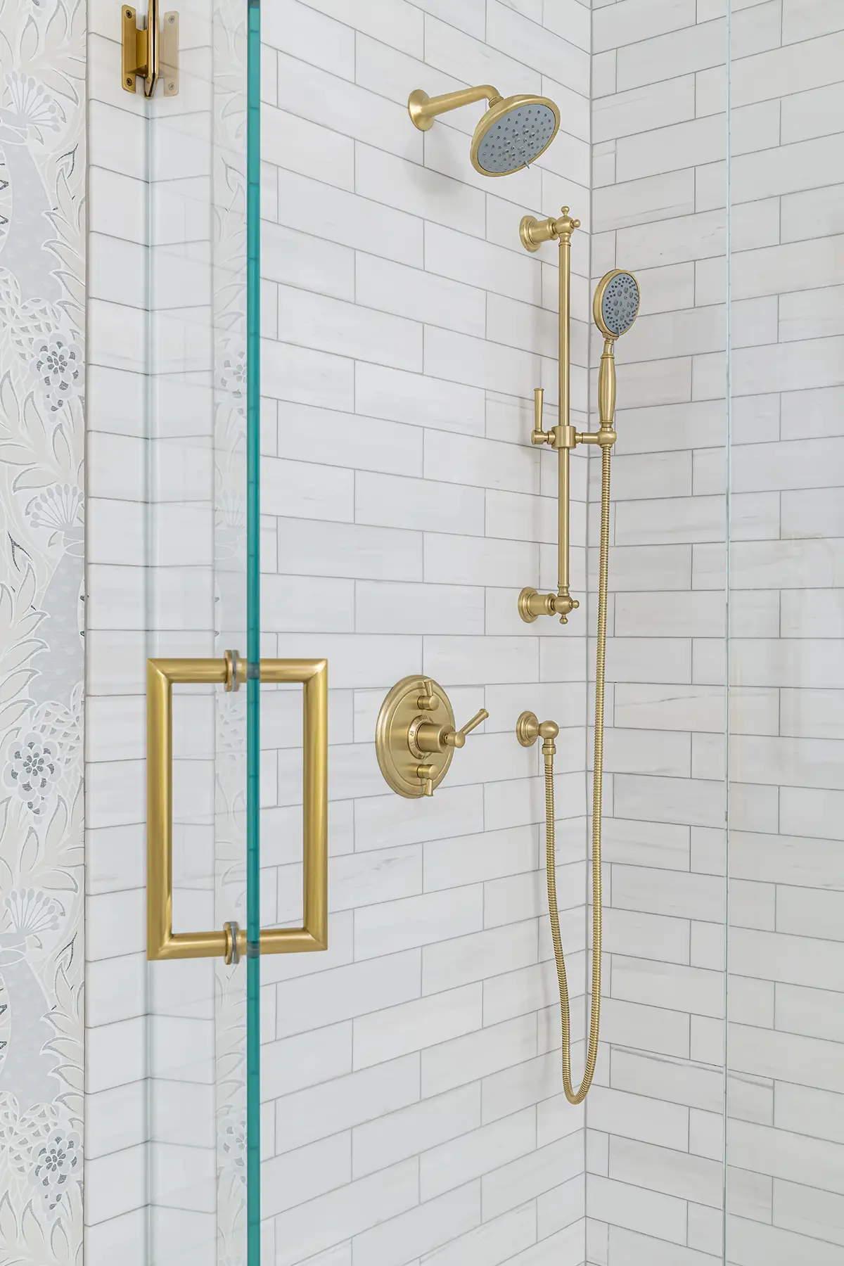 Great Rd, Princeton, NJ 08540 6 | The Home X Luxury shower with brass fixtures, vertical subway tile, and glass door in Princeton, NJ remodel