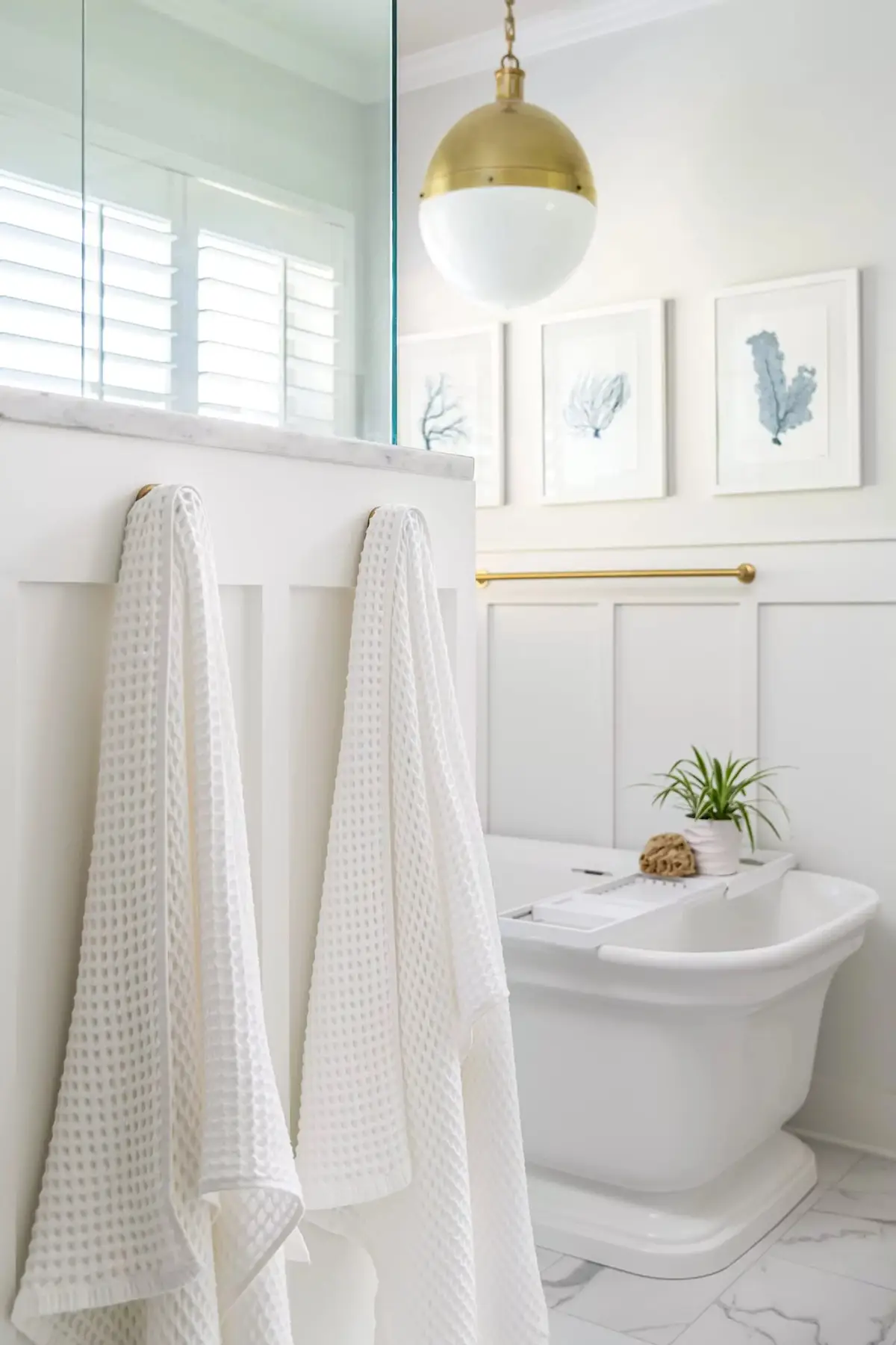 Mt Lucas Rd, Princeton, NJ 08540 6 | The Home X Elegant bathroom with freestanding tub, brushed gold fixtures, and white curtain accents.