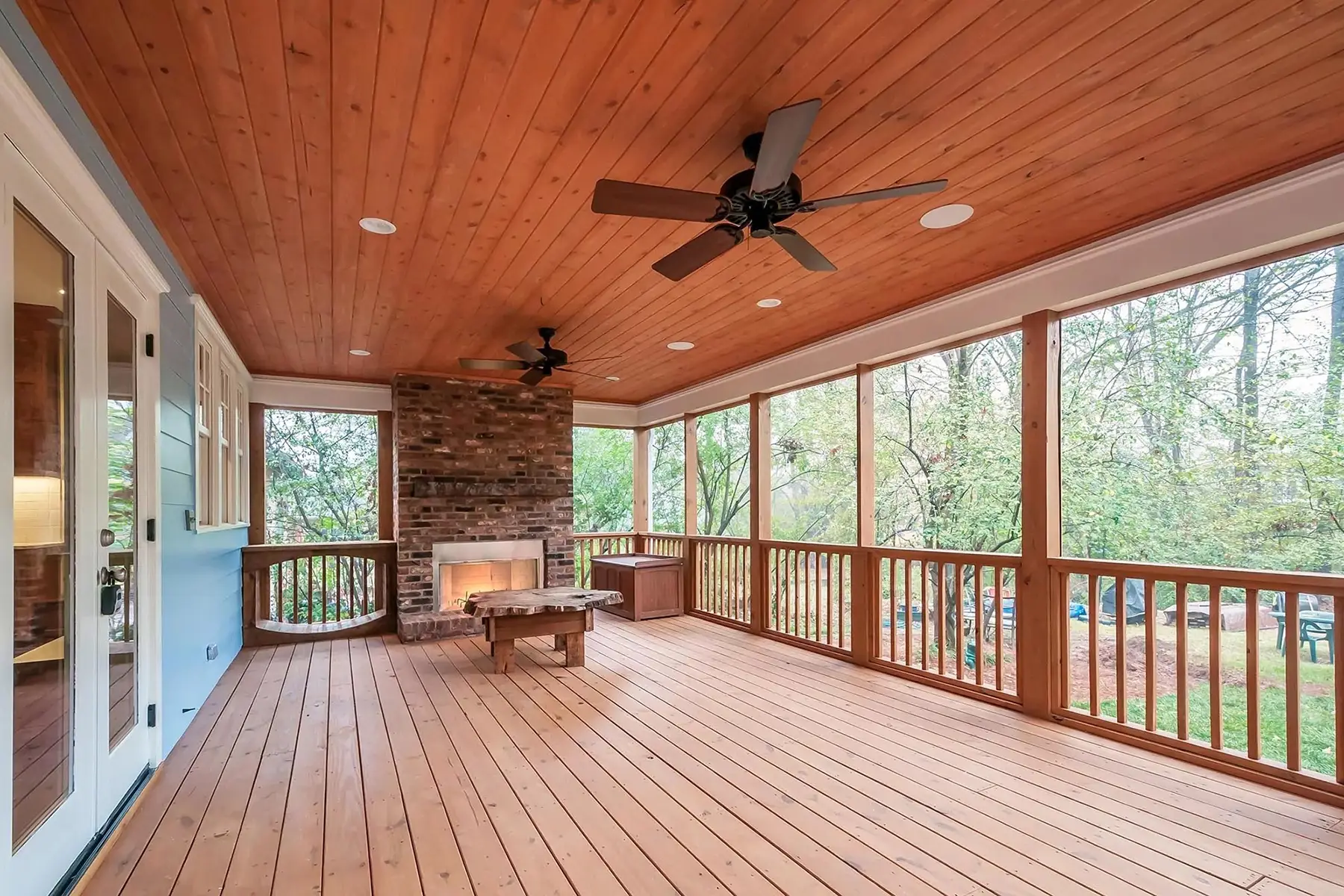 Brunswick Pike, Lambertville, NJ 08530 2 | The Home X Screened-in porch with wood flooring, ceiling fan, and wooded views in Lambertville, NJ remodel