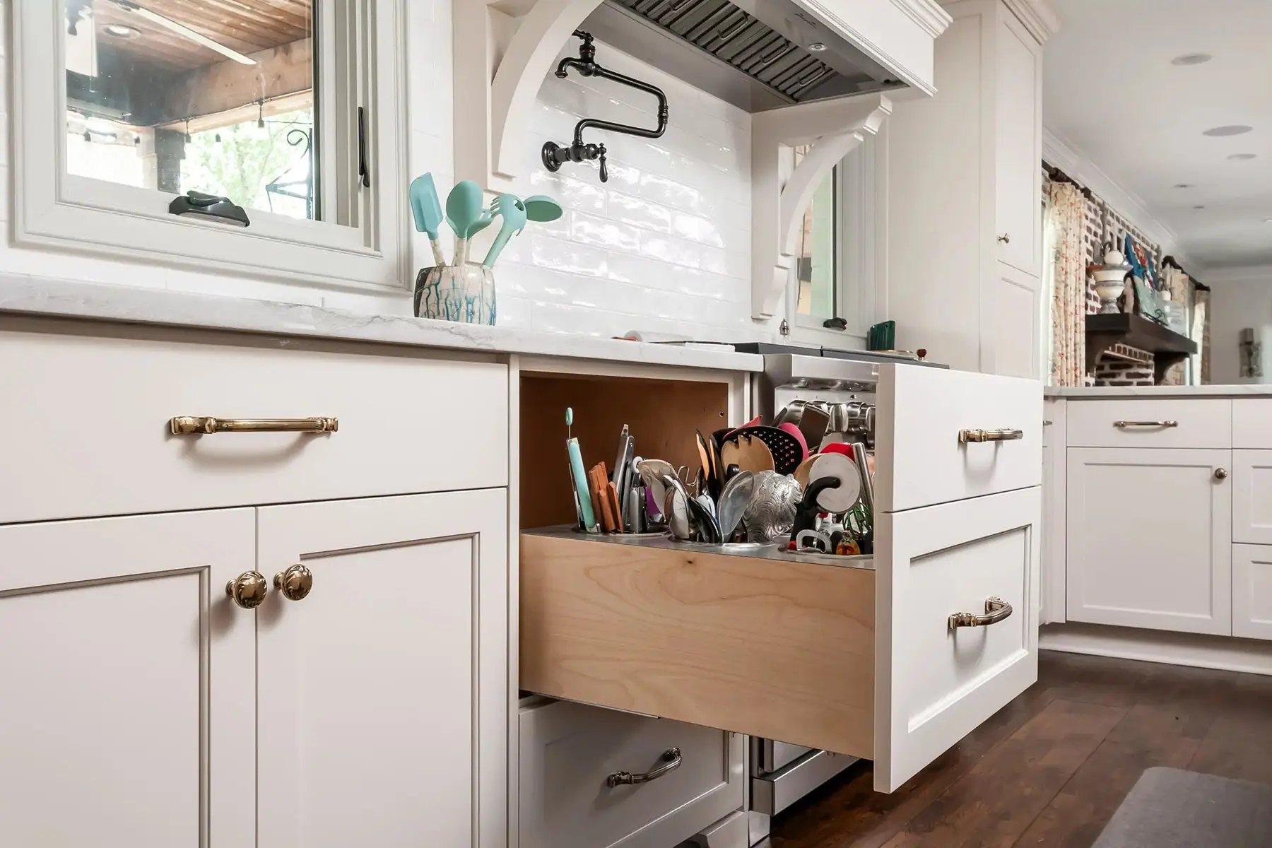 Lake Dr, Princeton, NJ 08540 6 | The Home X Pull-out drawer storage with oak dividers and brass hardware in custom Princeton, NJ bar cabinetry