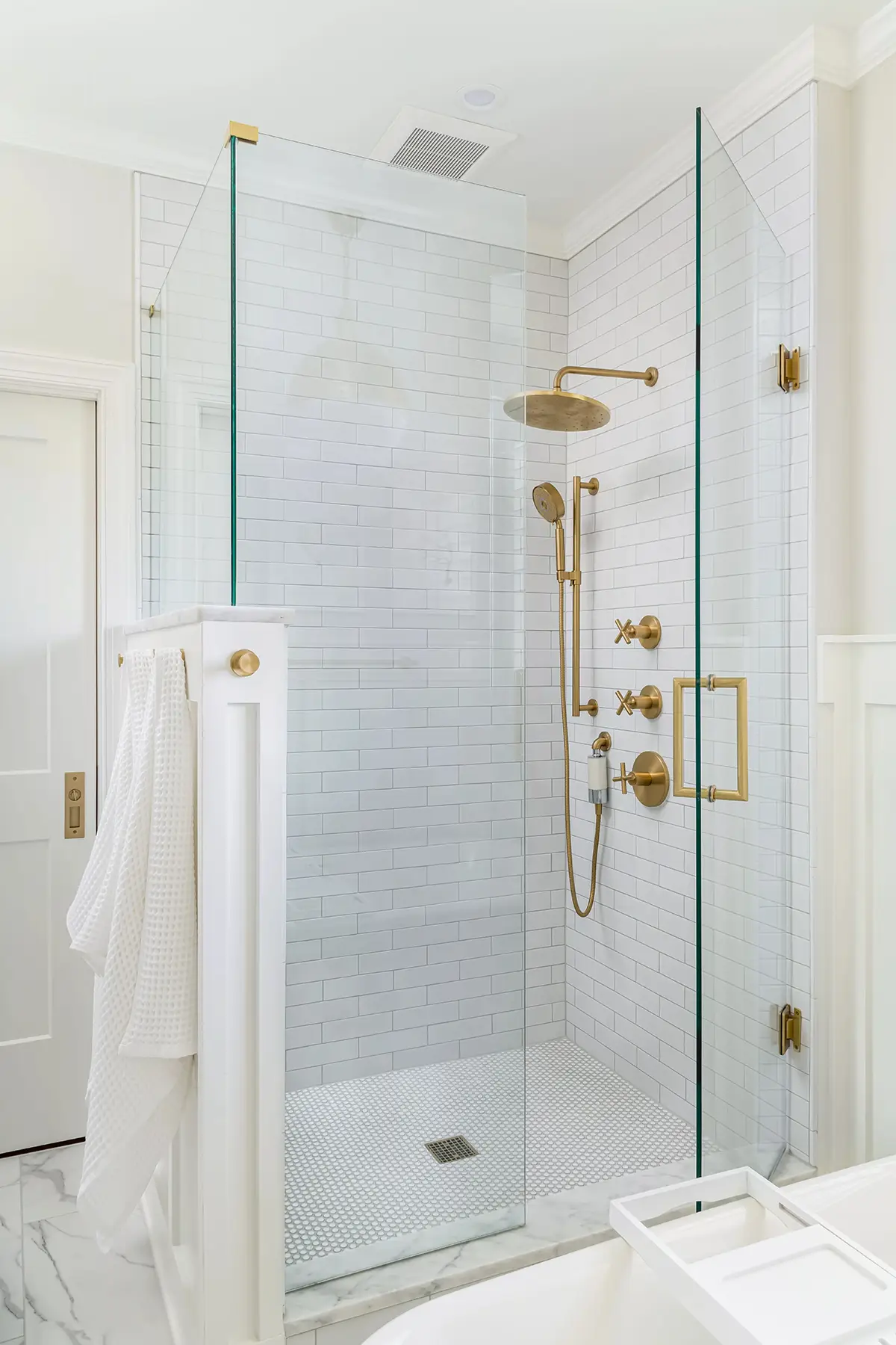 Mt Lucas Rd, Princeton, NJ 08540 7 | The Home X Modern walk-in shower with glass enclosure, brass fixtures, and built-in niche.