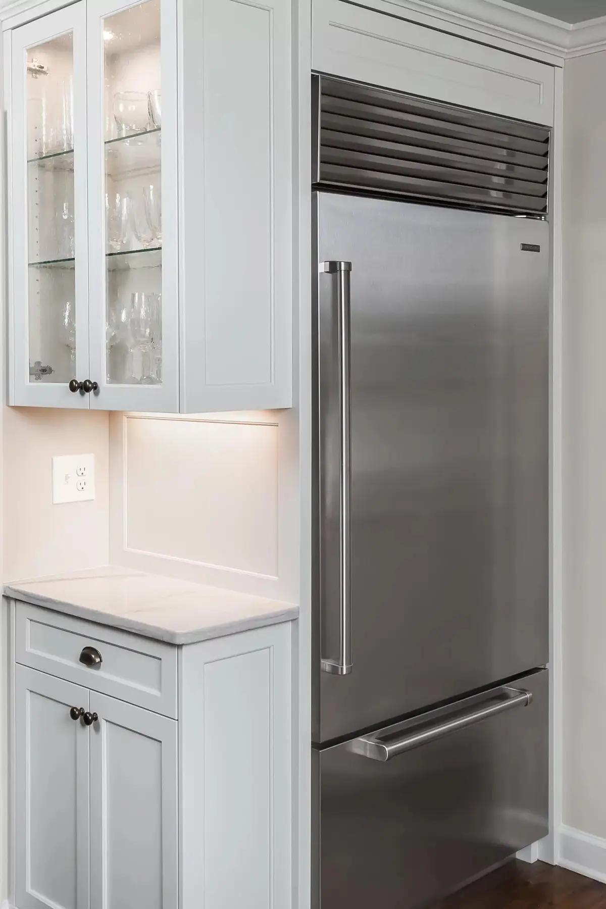 Pineville Rd, Newtown, PA 18940 9 | The Home X Built-in microwave and stainless steel refrigerator in a modern white kitchen.