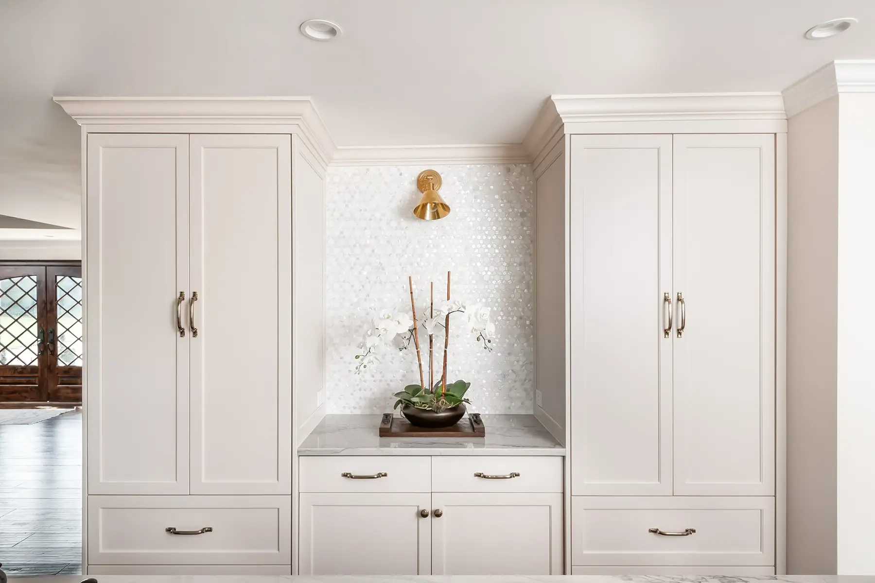 Lake Dr, Princeton, NJ 08540 8 | The Home X White oak built-in bar with paneled drawers, brass sconces, and custom shelving in Princeton, NJ