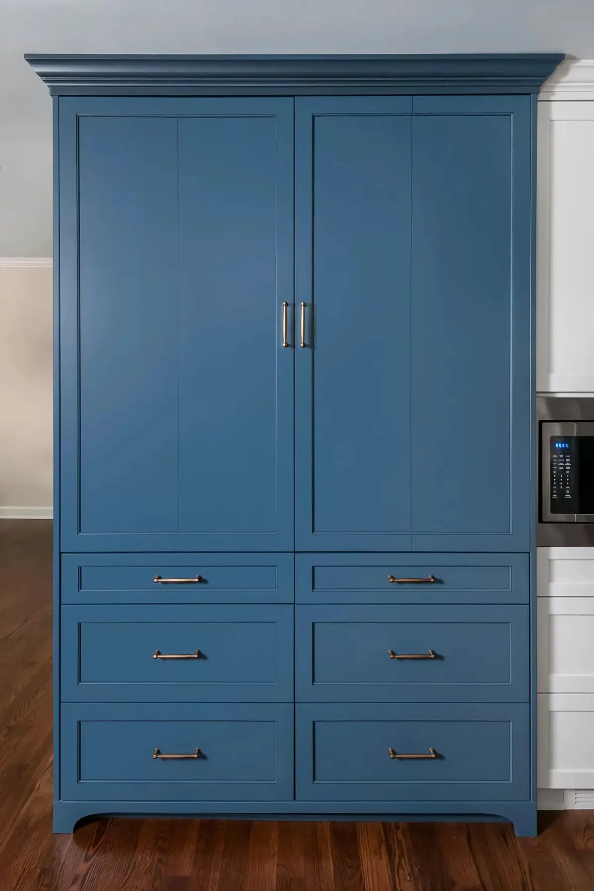 Pineville Rd, Newtown, PA 18940 10 | The Home X Custom tall blue pantry cabinet with drawers and brass hardware.