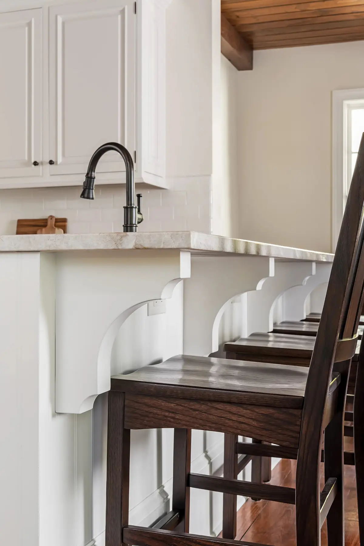 Woodhill Rd, Newtown, PA 18940 10 | The Home X Compact coffee bar with white cabinetry, brass faucet, and espresso machine tucked beside seating area.