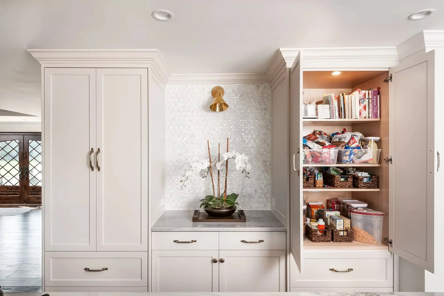 Lake Dr, Princeton, NJ 08540 9 | The Home X Full view of custom home bar with white oak cabinetry, glass shelving, and brass accents in Princeton, NJ