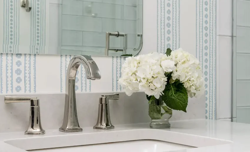 Custom vanity with marble top and polished nickel faucet in a serene New Hope, PA bathroom remodel.