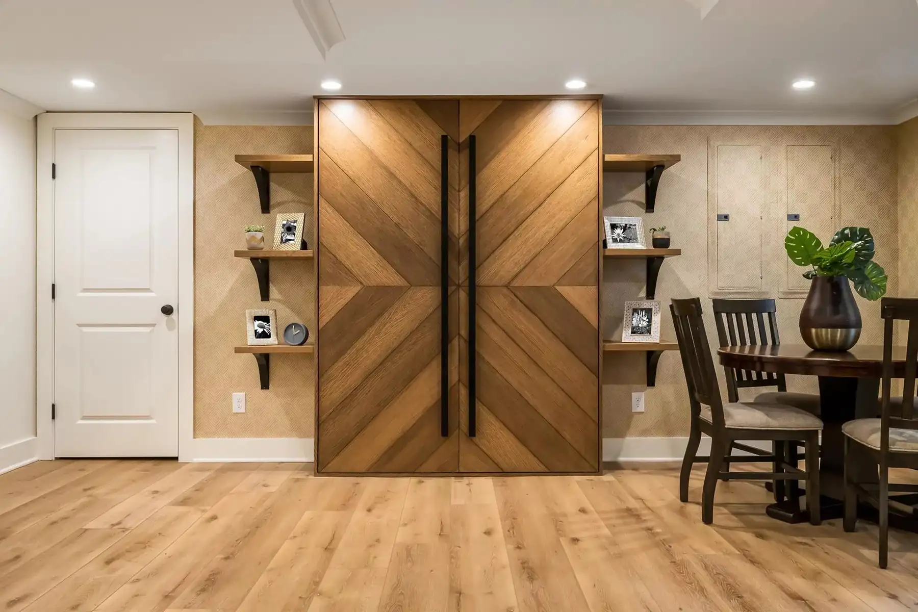 Federal City Rd, Pennington, NJ 08534 2 | The Home X Custom chevron wood-paneled doors in a modern basement entertainment space with built-in shelving.