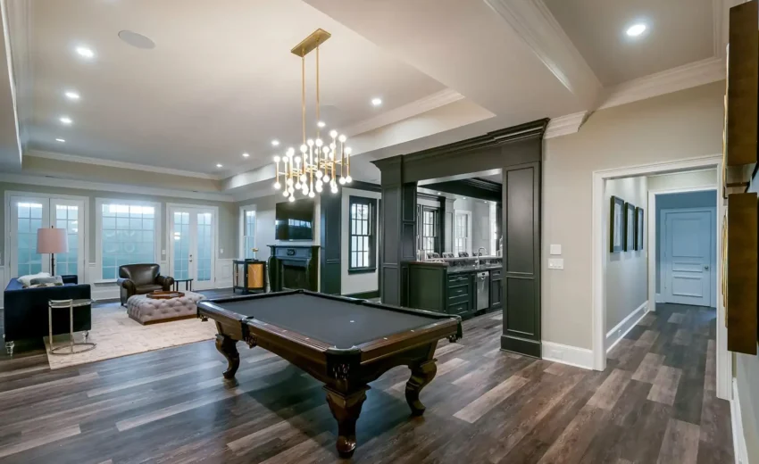 Spacious finished basement with pool table, recessed lighting, and wide plank flooring in New Hope, PA remodel.