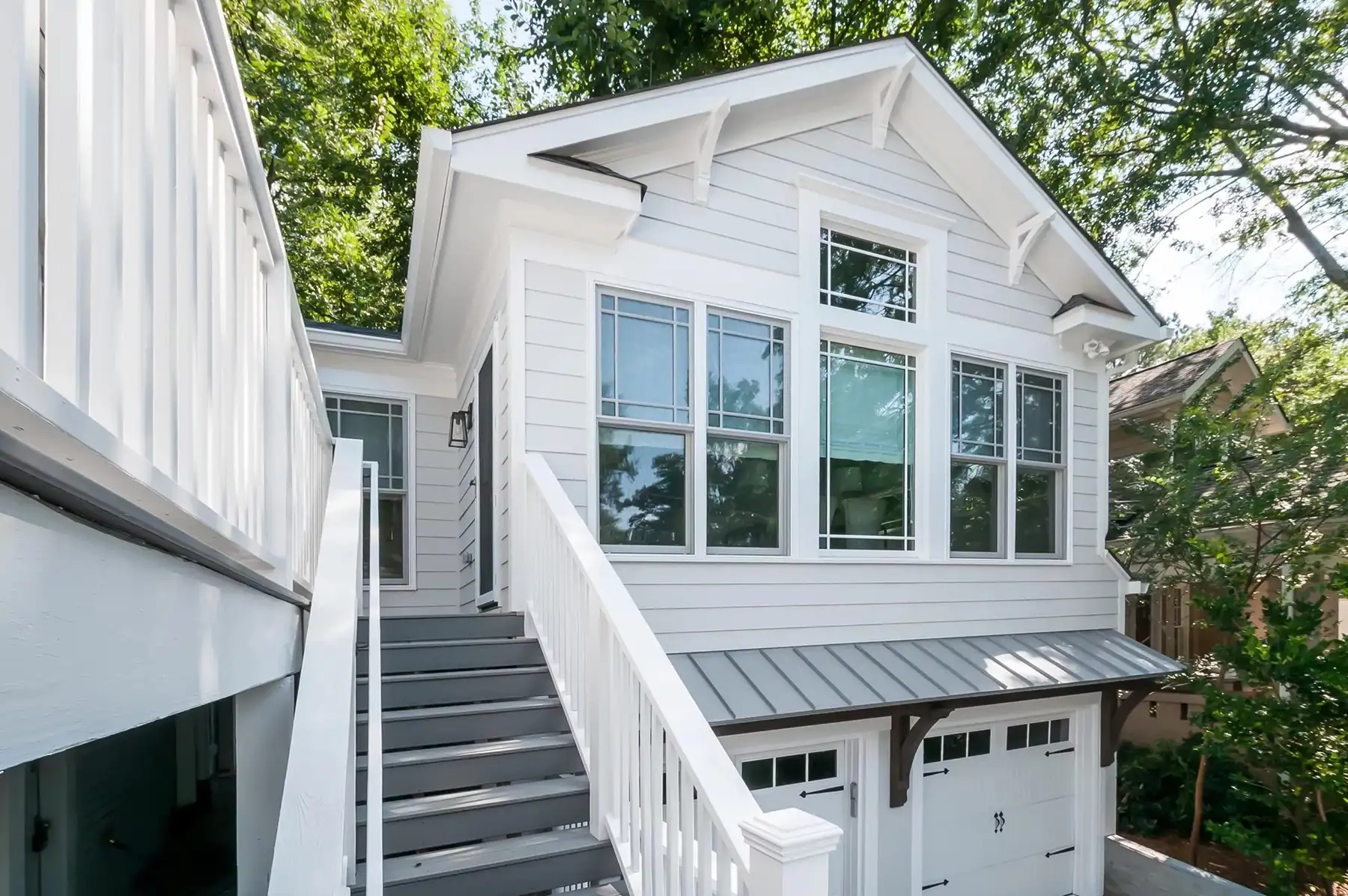 Washington Crossing Pennington Rd, Pennington, NJ 08534 1 | The Home X Two-story home with gable roof, white siding, and expansive second-story windows above a natural stone foundation.