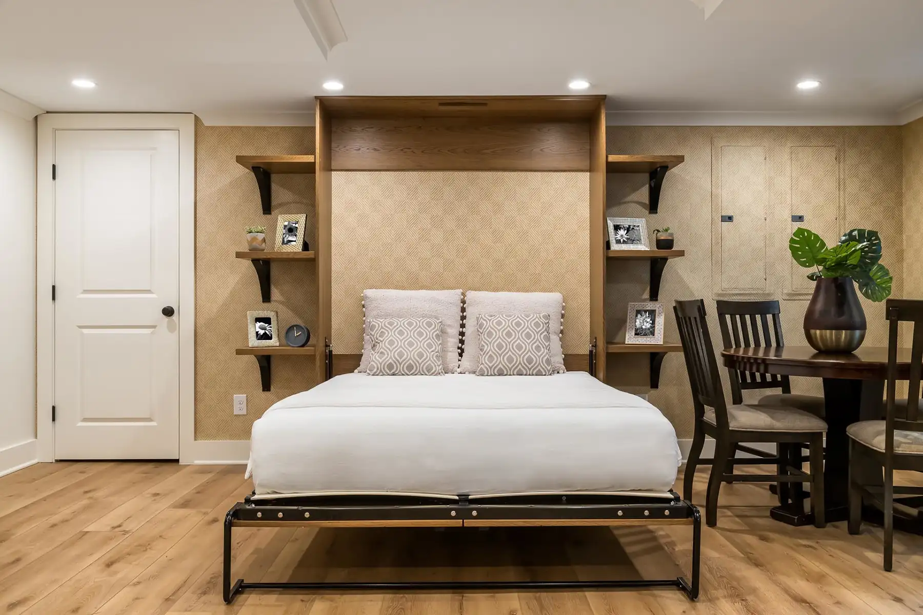 Federal City Rd, Pennington, NJ 08534 3 | The Home X Modern basement guest suite with built-in wood panel headboard, floating nightstands, and recessed lighting.