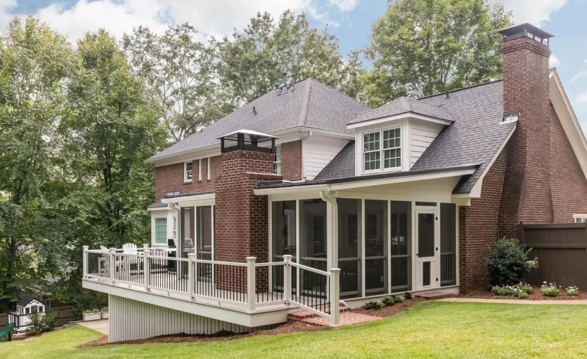 Back exterior view of a brick home with screened porch and elevated deck in Princeton, NJ.