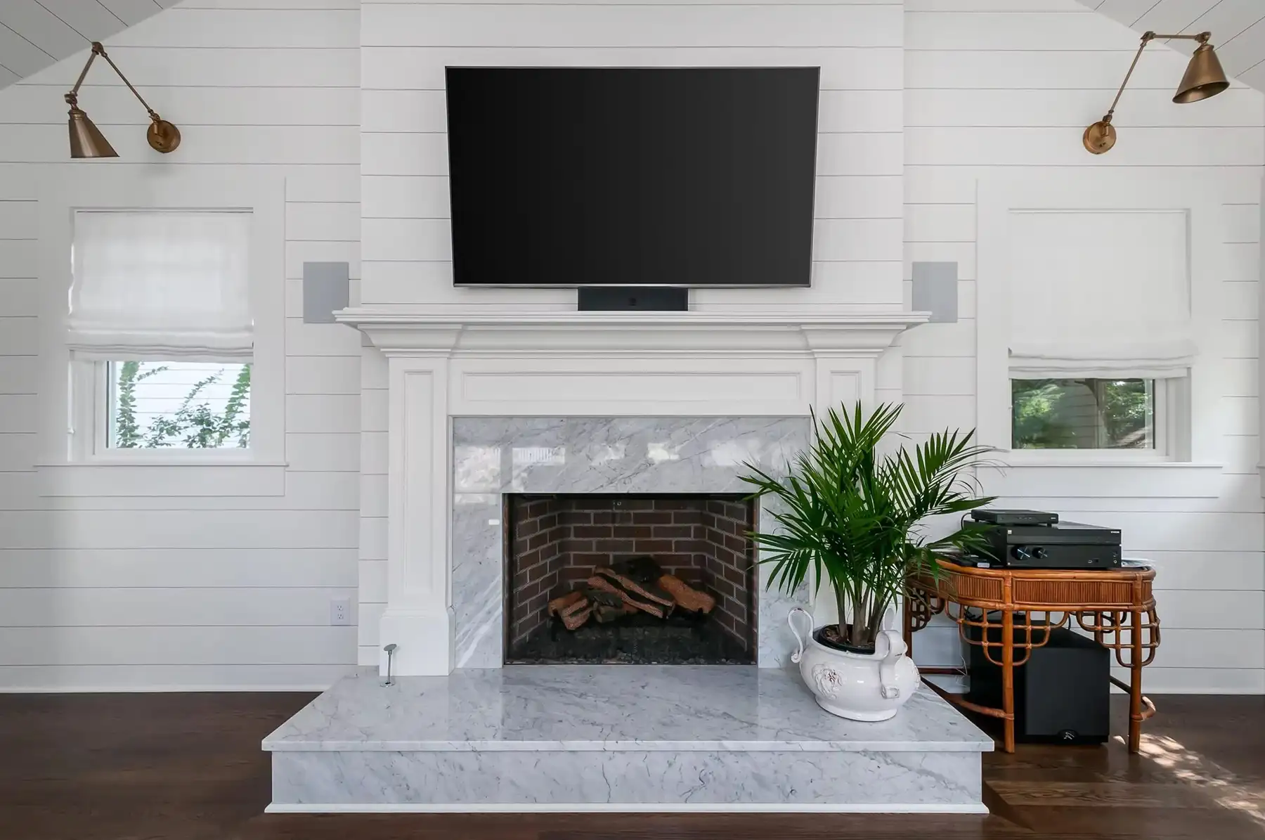 Washington Crossing Pennington Rd, Pennington, NJ 08534 2 | The Home X Modern living room with white shiplap walls, fireplace with rustic wood mantel, and mounted flat-screen TV.