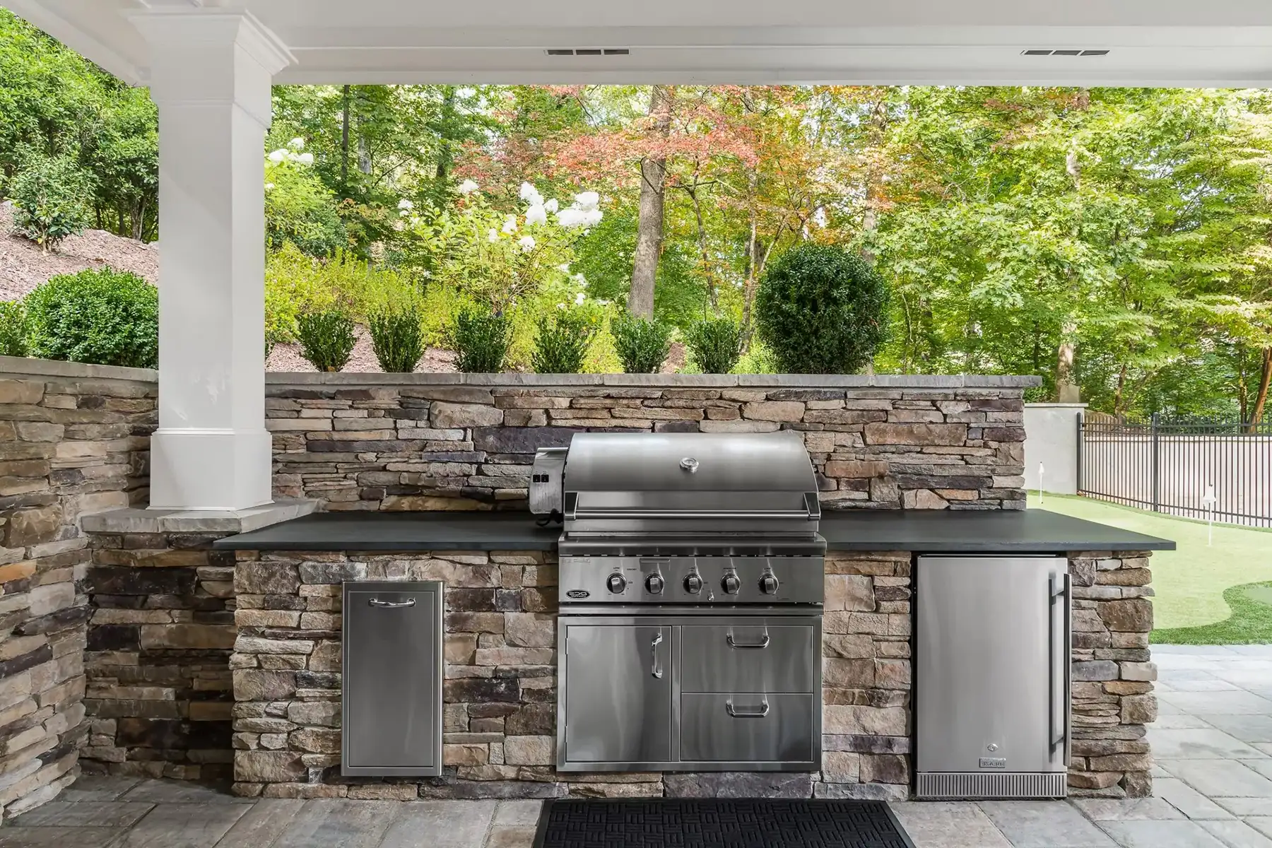 Sergeantsville Rd, Delaware Twp., 08559 3 | The Home X Outdoor kitchen with built-in stainless grill, stone bar, and spacious countertop beneath covered pavilion.