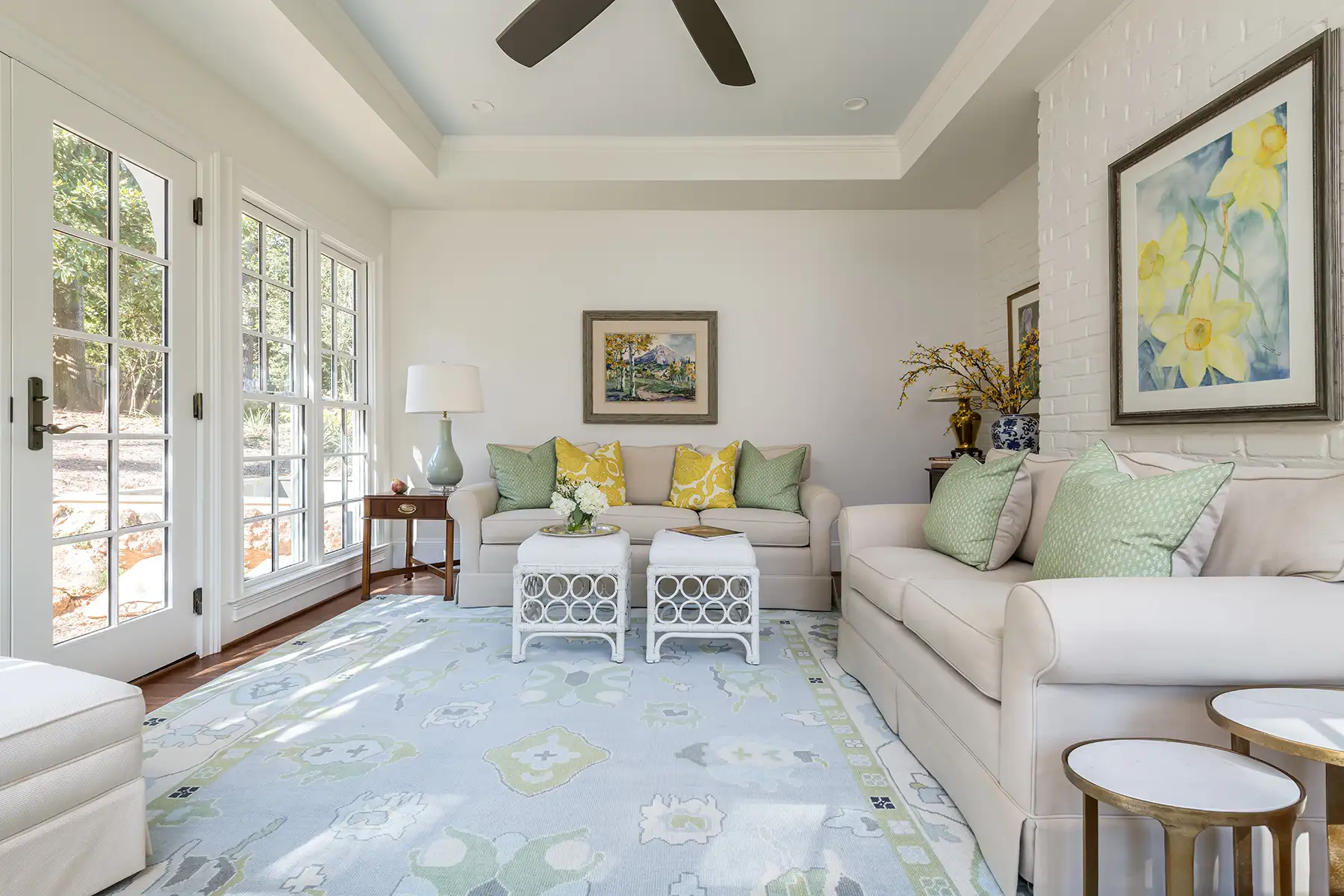 Woodside Rd, Yardley, PA 19067 4 | The Home X Bright sunroom interior with vaulted ceiling, soft neutral furnishings, and surrounding windows for natural light.