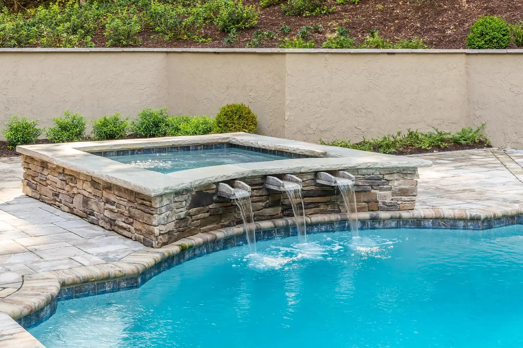 Sergeantsville Rd, Delaware Twp., 08559 7 | The Home X Elevated spa spilling into modern pool with stone coping and raised garden beds in the background.