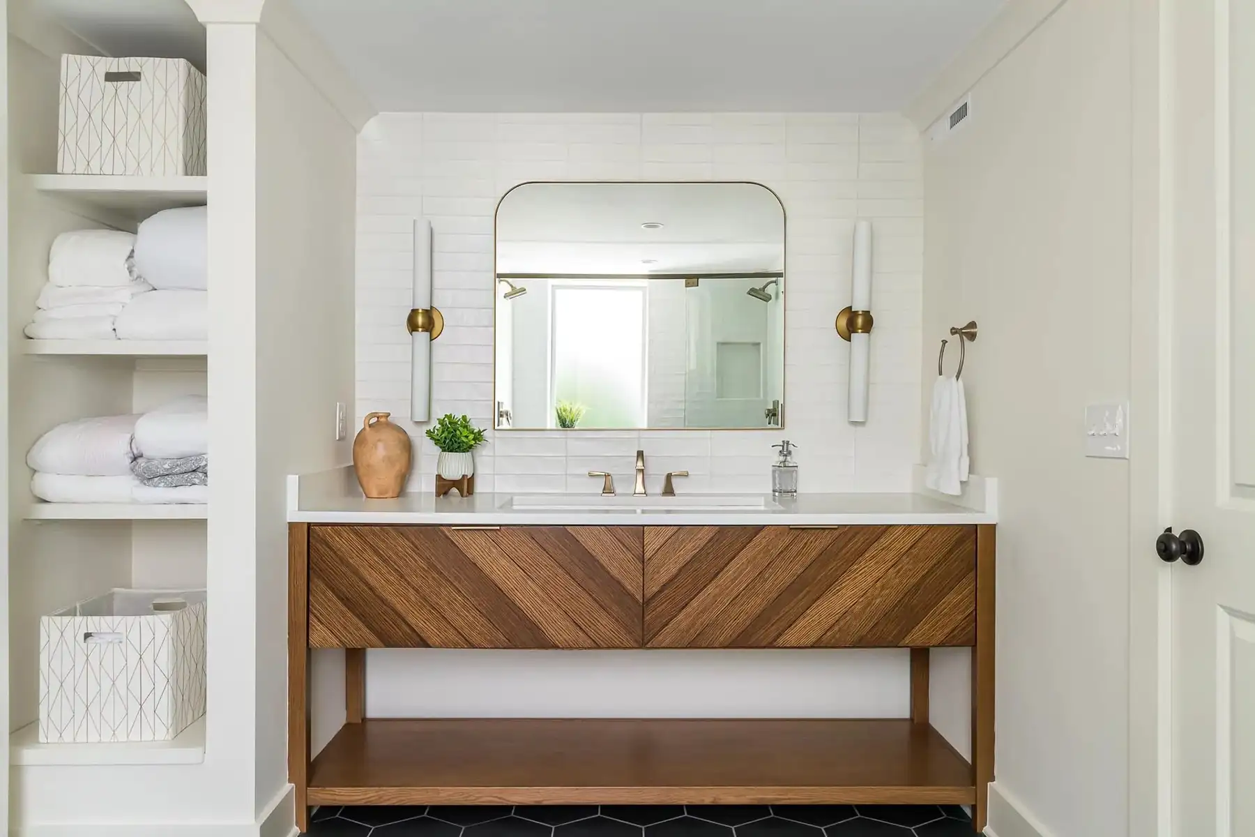 Federal City Rd, Pennington, NJ 08534 11 | The Home X Elegant bathroom vanity with double sinks, wooden cabinetry, and a large mirror under soft lighting.