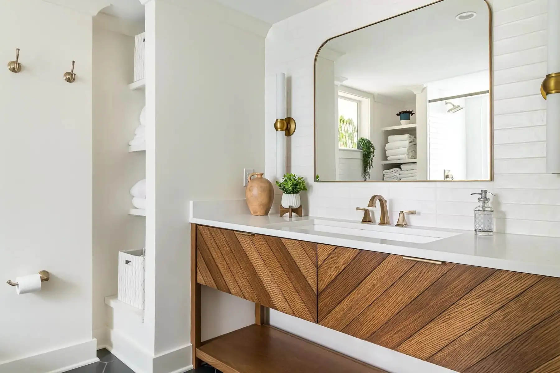 Federal City Rd, Pennington, NJ 08534 12 | The Home X Modern bathroom with a wooden vanity, large mirror, white walls, and minimalist fixtures.