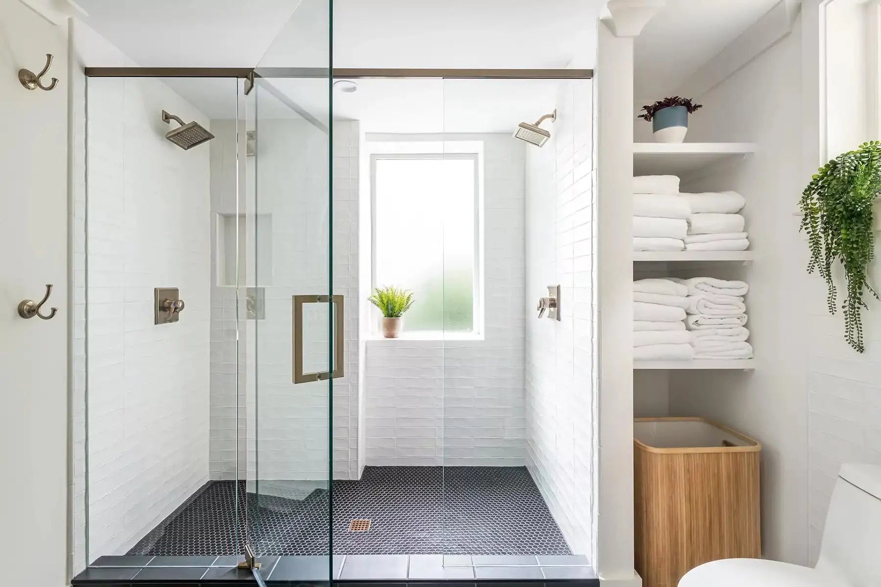 Federal City Rd, Pennington, NJ 08534 15 | The Home X Elegant bathroom vanity with white cabinetry, dual sinks, large mirrors, and brass fixtures.