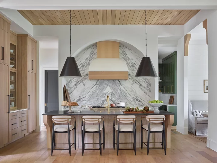 Luxury kitchen remodel in Princeton featuring waterfall quartz island, modern pendant lighting, and custom cabinetry by The Home X.
