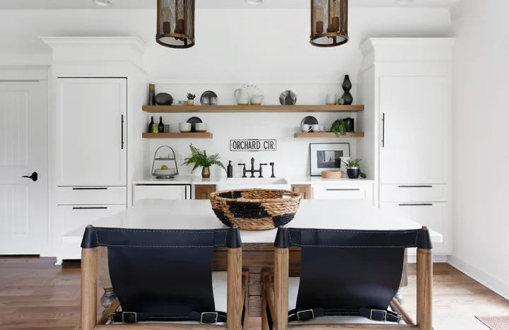 Kitchen Remodeling 63 | The Home X Bright white kitchen remodel featuring a central island with seating, pendant lighting, and clean shaker cabinetry by The Home X.