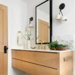 White oak floating vanity with brass faucet and quartz countertop in Washington Crossing, Pennsylvania