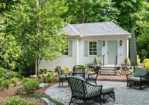 Luxury home remodel featuring updated exterior, new roofline, and architectural landscaping at 01 Pennington Titusville Rd in Pennington, NJ by The Home X.