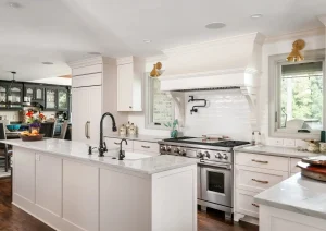 Built-in bar with white oak cabinets, beverage cooler, and matte black shelving in a Princeton, NJ home