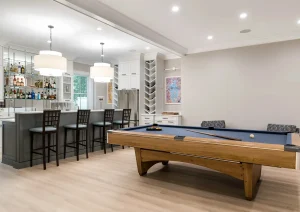 Luxury finished basement remodel in Newtown, PA featuring open-concept layout, entertainment area, and custom cabinetry by The Home X.