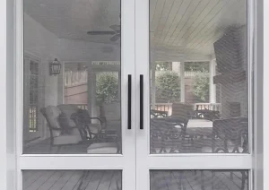 Full-height glass patio doors leading from interior to exterior living space at Great Rd home in Princeton, NJ.