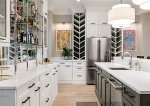 High-end basement kitchenette with white shaker cabinets, mosaic tile backsplash, and pendant lighting in Newtown PA