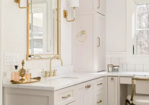 Built-in bathroom vanity with quartz top and warm brass accents in New Hope, PA luxury home remodel