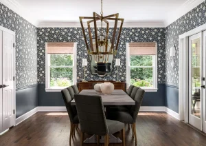 Elegant formal dining room with chandelier, tray ceiling, and classic millwork.