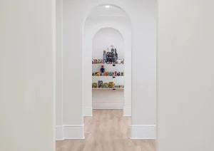 Elegant arched hallway with repeated archways and wood floors in Newtown PA basement remodel