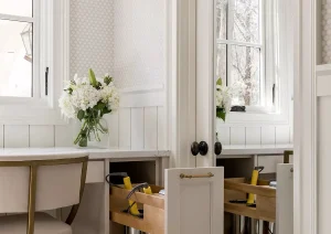 Pull-out vanity station with cushioned stool and built-in drawer storage in New Hope, PA luxury bathroom