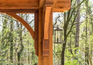 Timber-framed patio structure overlooking a wooded forest in New Hope, PA.