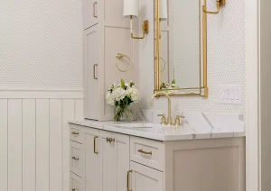 Refined double vanity with quartz counters, brass hardware, and sconce lighting in New Hope, PA bathroom remodel