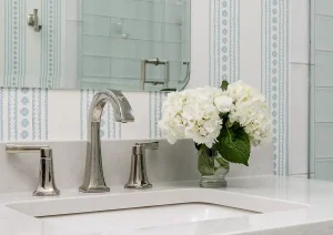 Custom vanity with marble top and polished nickel faucet in a serene New Hope, PA bathroom remodel.