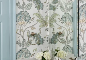 Elegant floral wallpaper and powder blue vanity in a boutique-style New Hope, PA bathroom remodel.