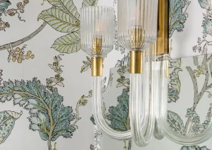 Gold rainfall shower with nature-inspired wallpaper in a luxury New Hope, PA bathroom.
