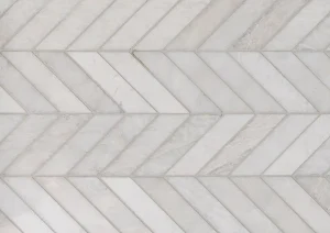 Chevron pattern shower wall tile in soft beige and ivory tones.